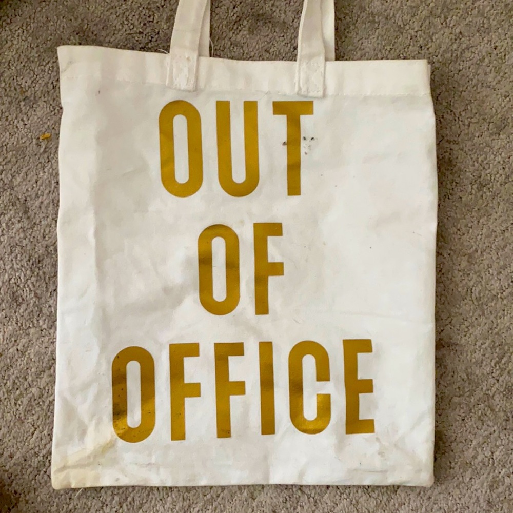 Canvas tote says “out of office on both sides”